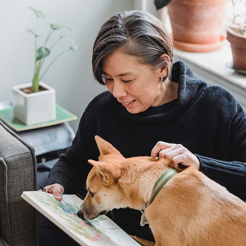 woman with dog and painting